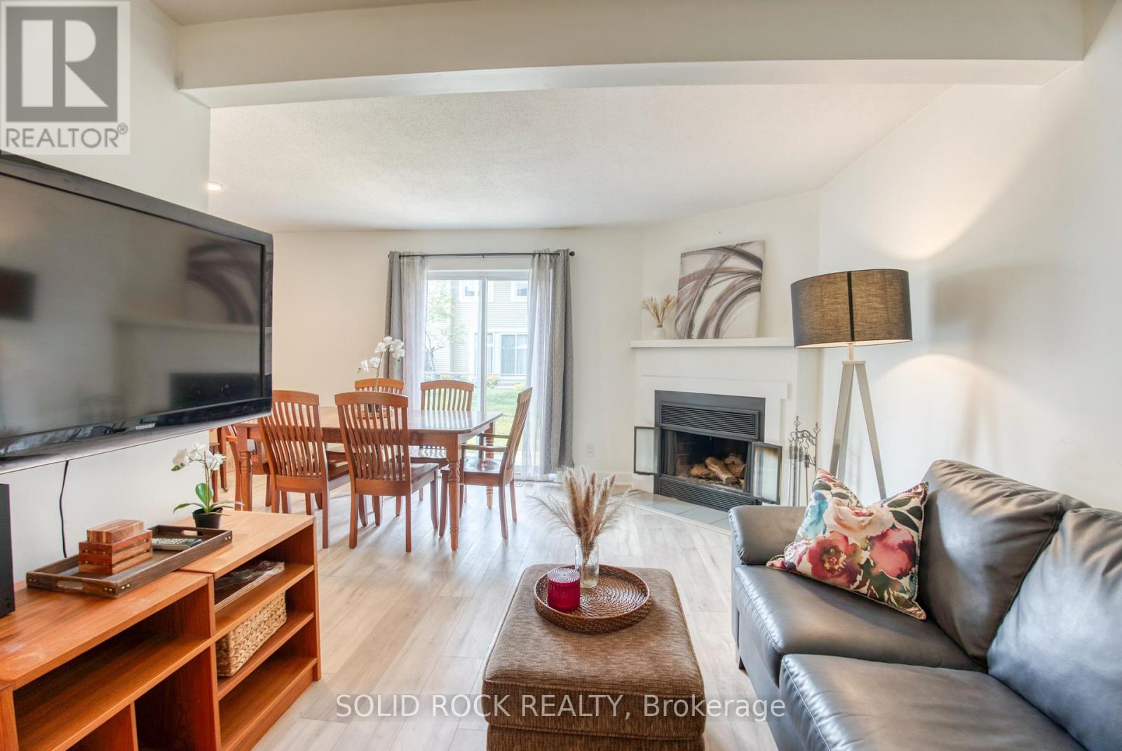 Living room with wood burning fireplace