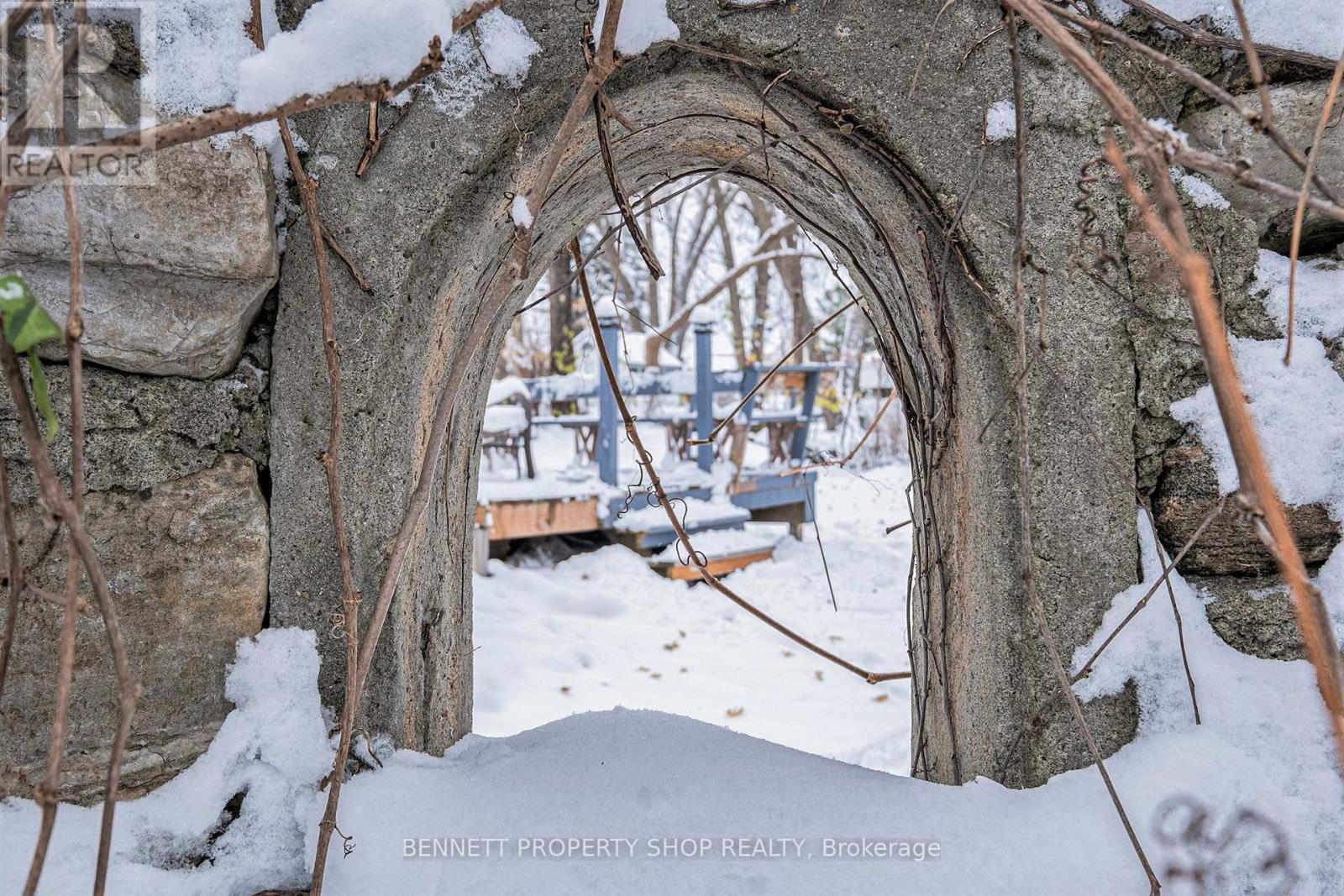 stone wall window - peek through into backyard
