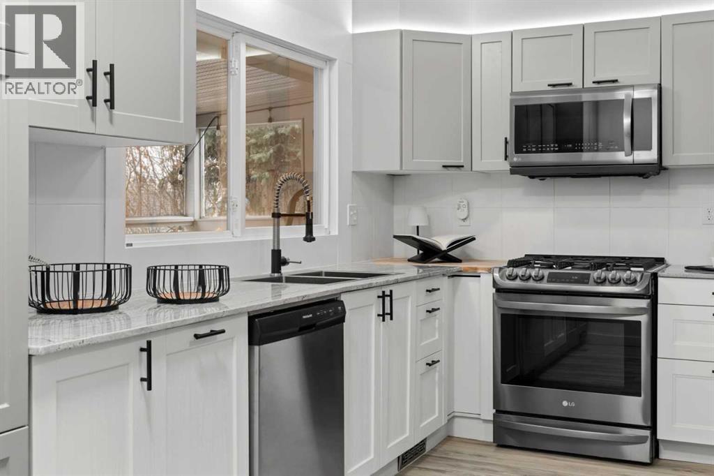 Single Family House Bi-level for Sale in  Bearspaw Drive NW Brentwood Calgary 