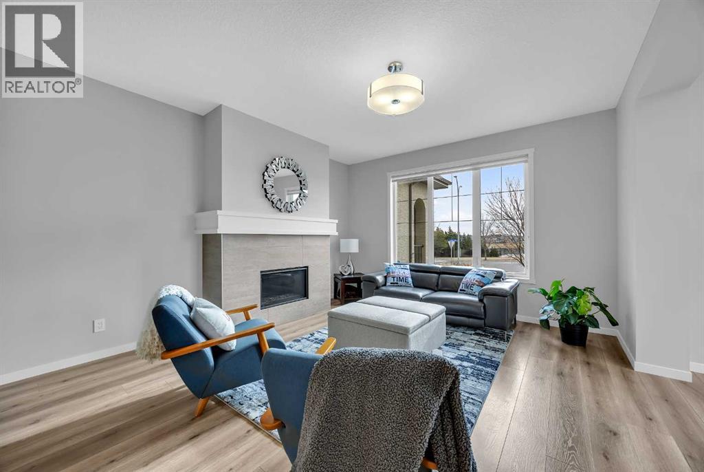 Bright and open with oversized triple-pane windows, 9-ft ceilings, and LVP flooring