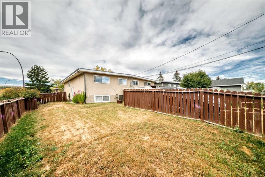Multi-family House Bi-level for Sale in  &  Huntford Close NE Huntington Hills Calgary 