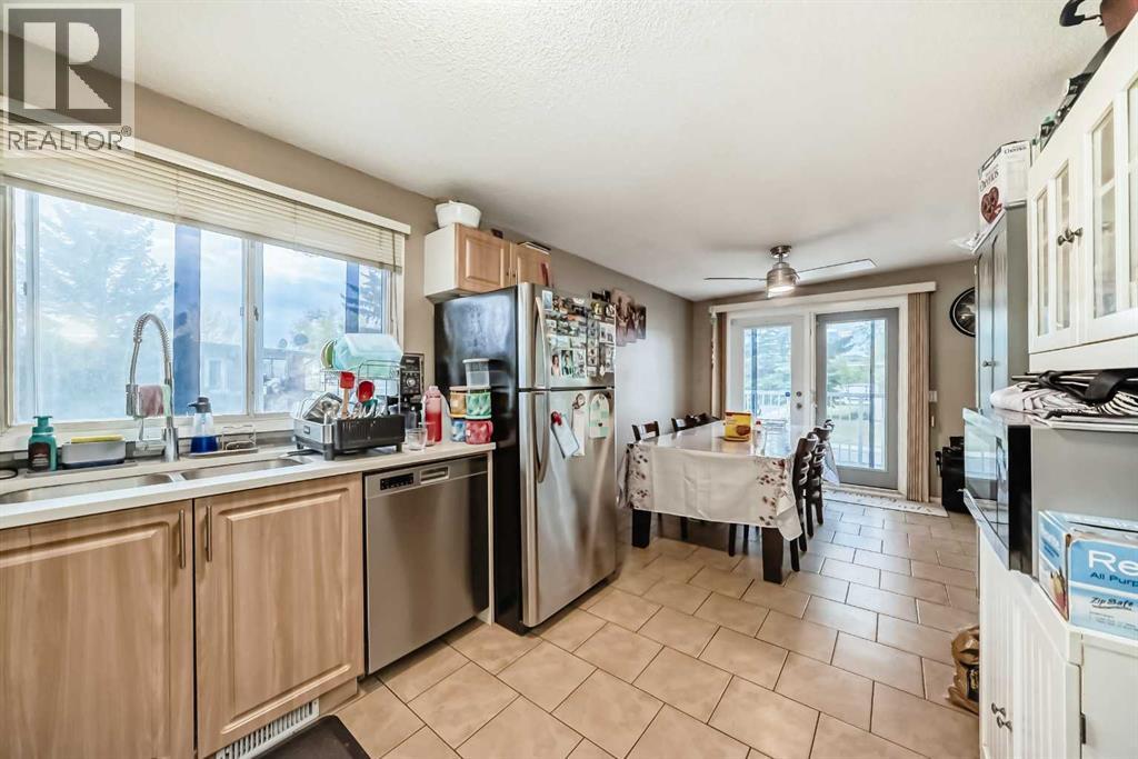 Multi-family House Bi-level for Sale in  &  Huntford Close NE Huntington Hills Calgary 