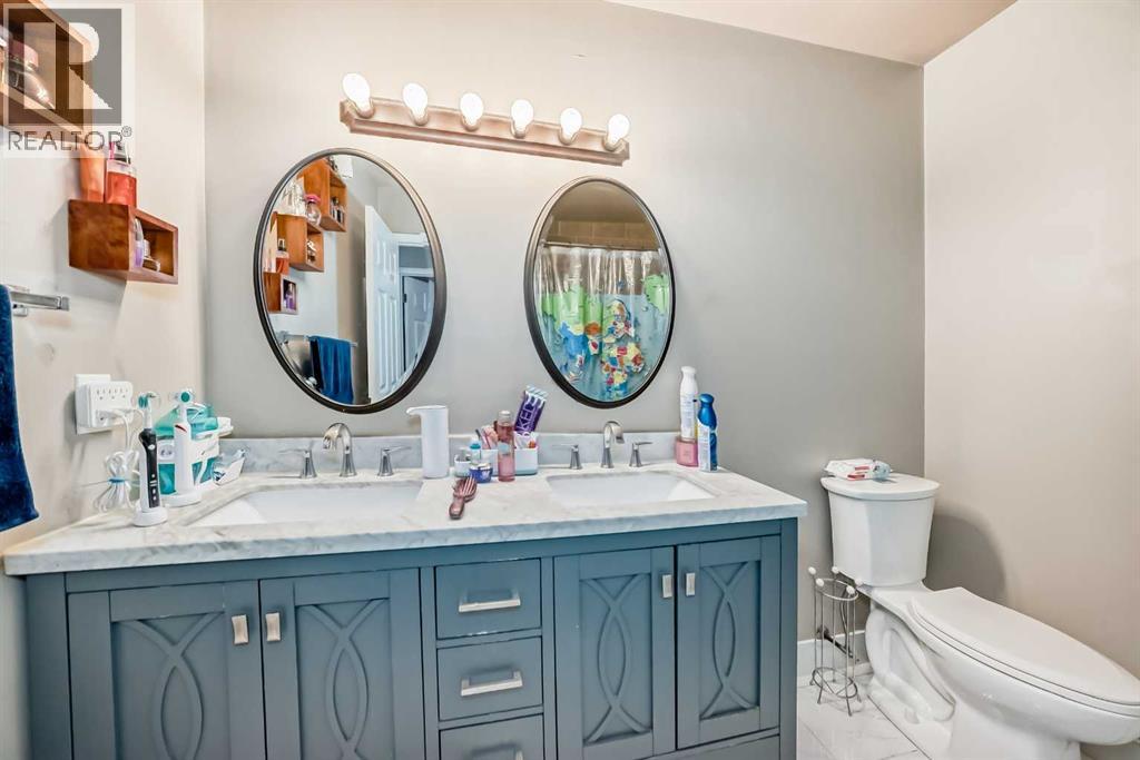 Multi-family House Bi-level for Sale in  &  Huntford Close NE Huntington Hills Calgary 