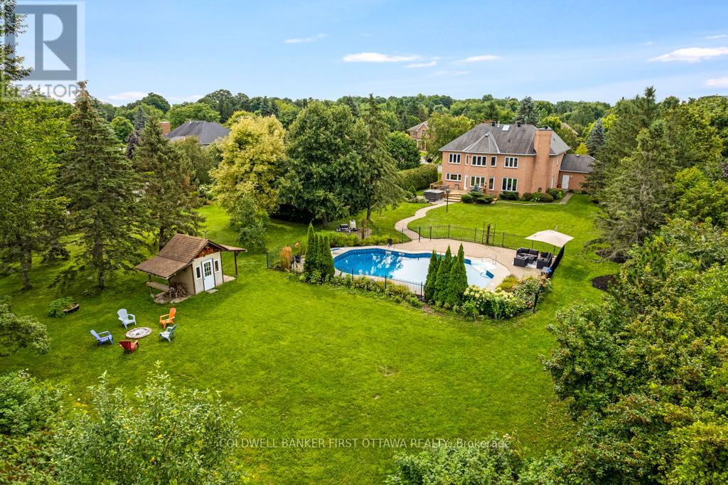 Park-like 0.7 acre with heated inground pool