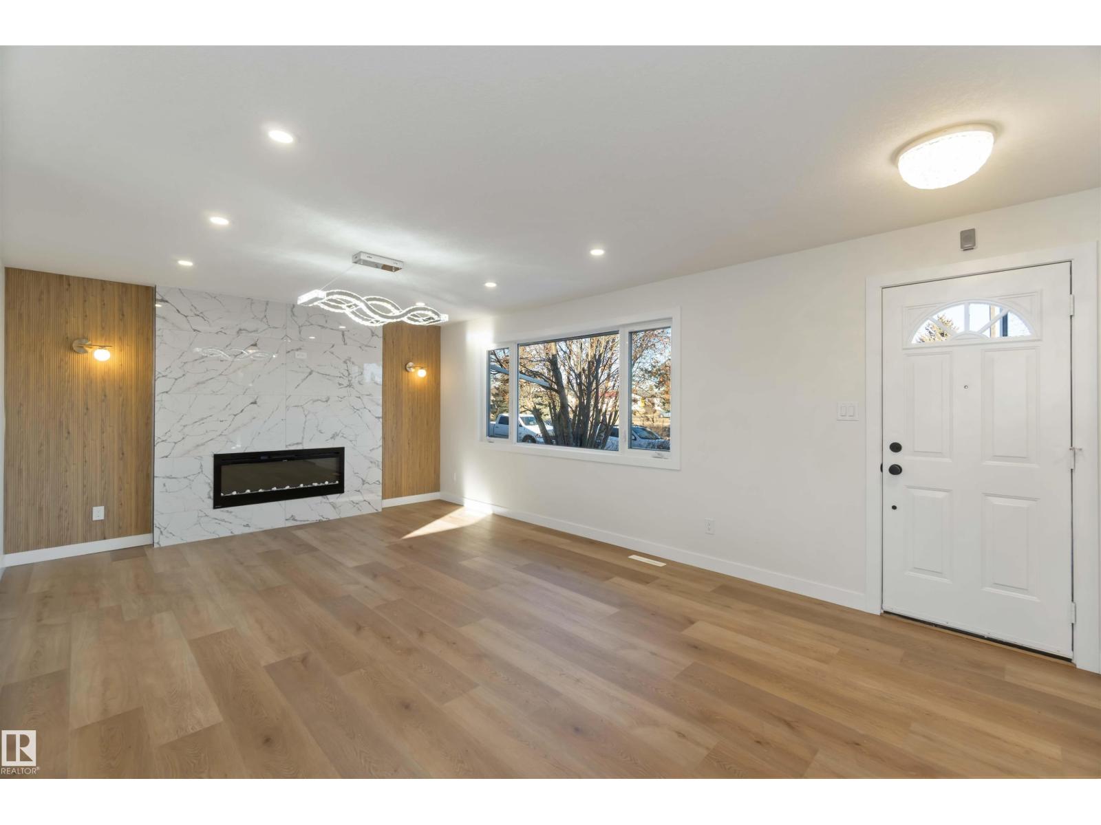 Main living and kitchen area inside 5907 137 AV NW Belvedere Edmonton