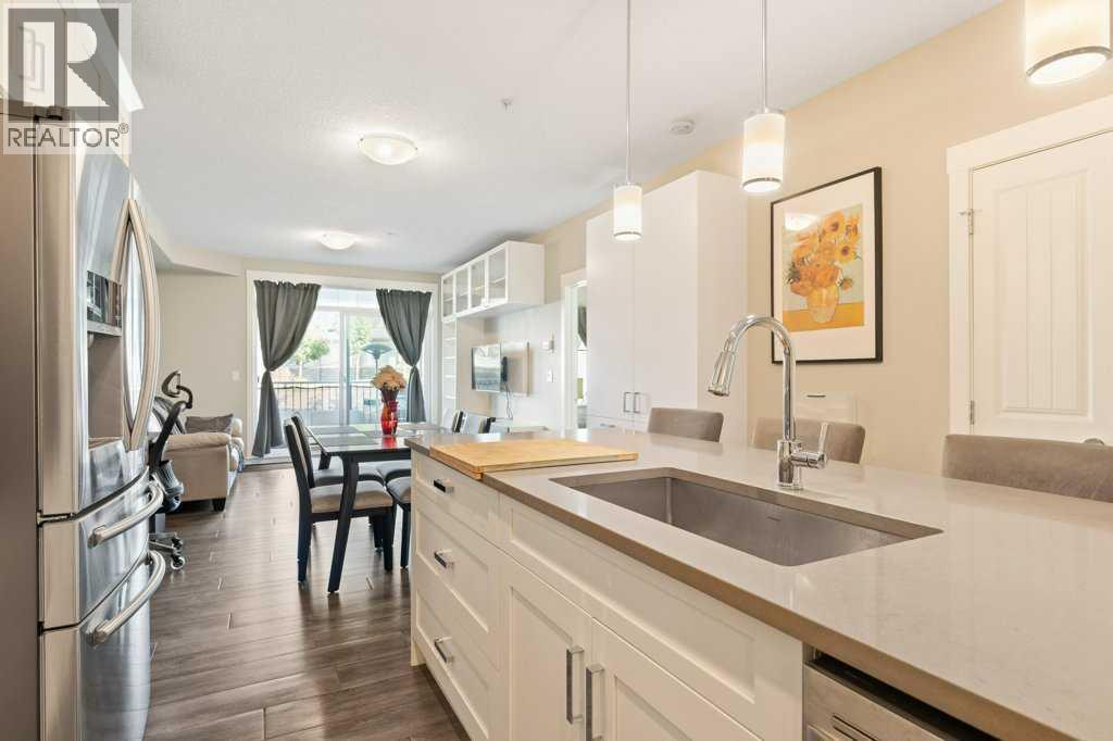 Expansive Center island with undermount large farm sink.   Expansive quartz counter tops throughout