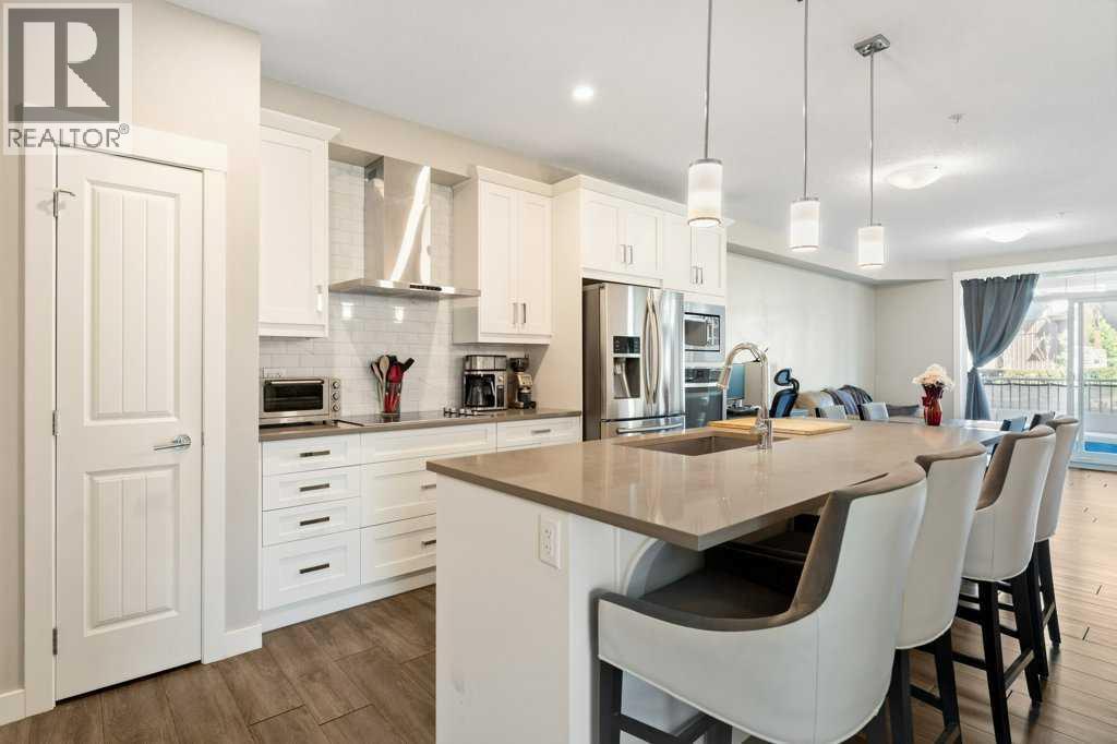 Upgraded Kitchen with built in appliances, extra long center island.  41" upper cabinets and under cabinet lighting