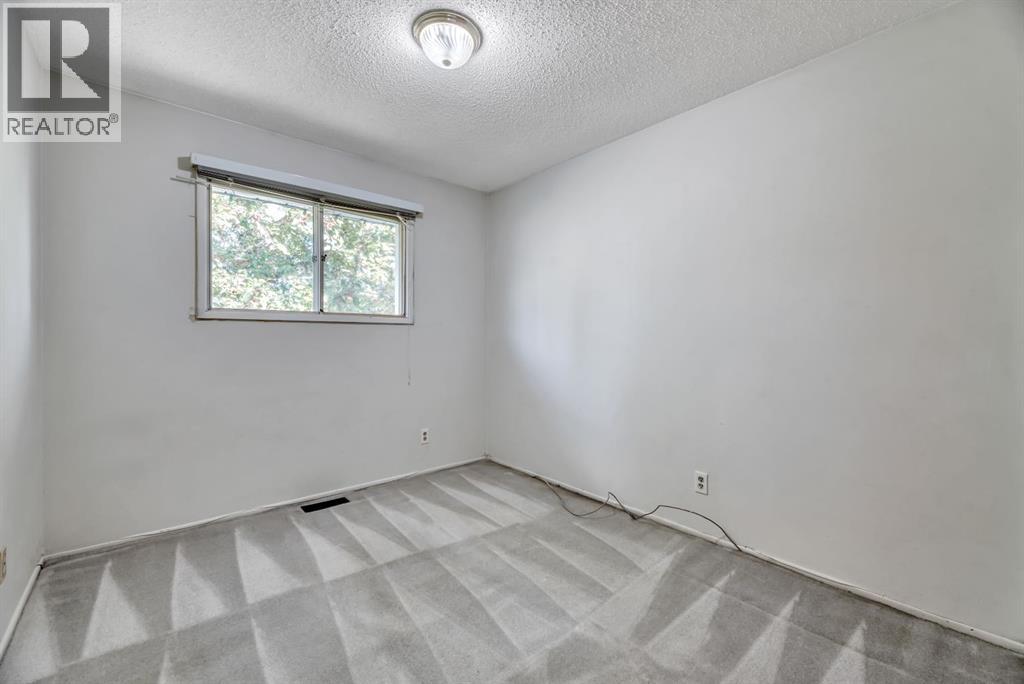 Single Family House Bi-level for Sale in  Brazeau Crescent SW Braeside Calgary 