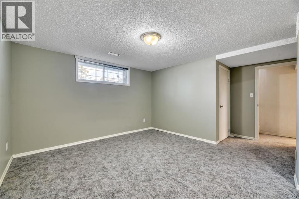 Single Family House Bi-level for Sale in  Brazeau Crescent SW Braeside Calgary 