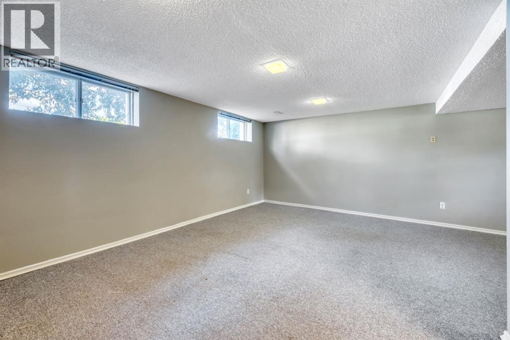 Single Family House Bi-level for Sale in  Brazeau Crescent SW Braeside Calgary 