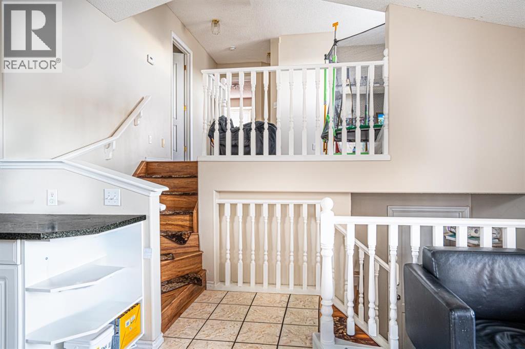 Single Family House 4 Level for Sale in  Laguna Way NE Monterey Park Calgary 