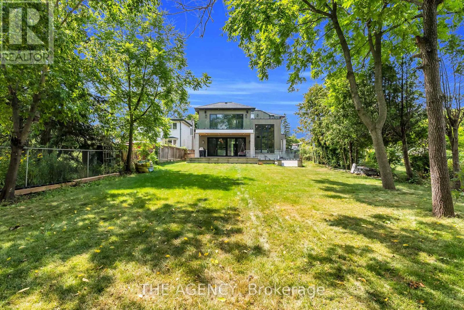 Rear elevation W/large porch and private backyard