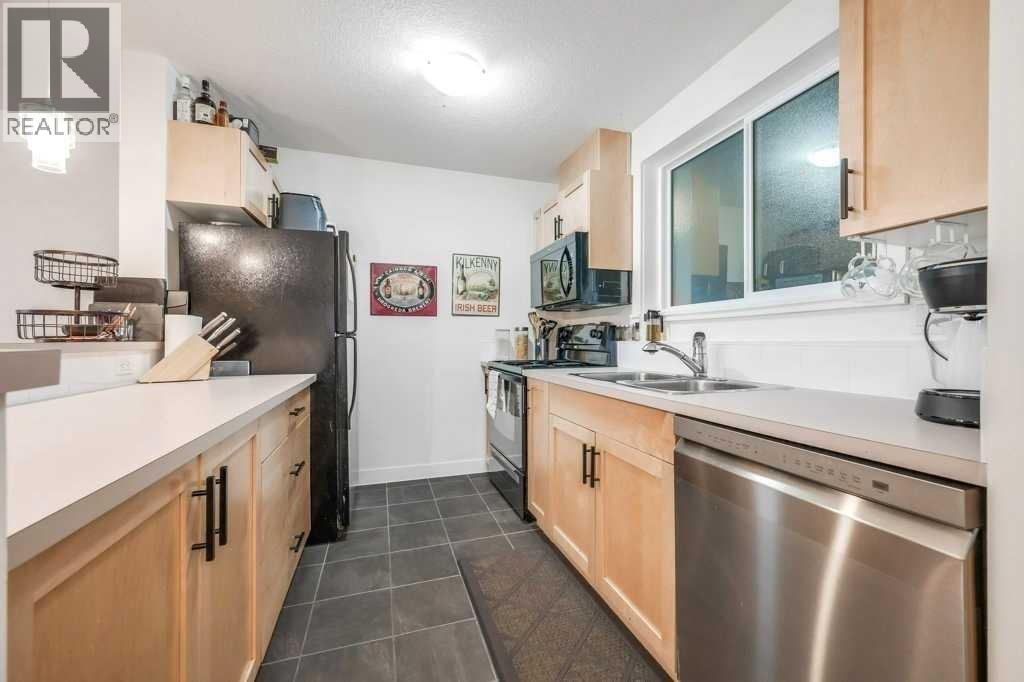 Kitchen with newer microwave and dishwasher