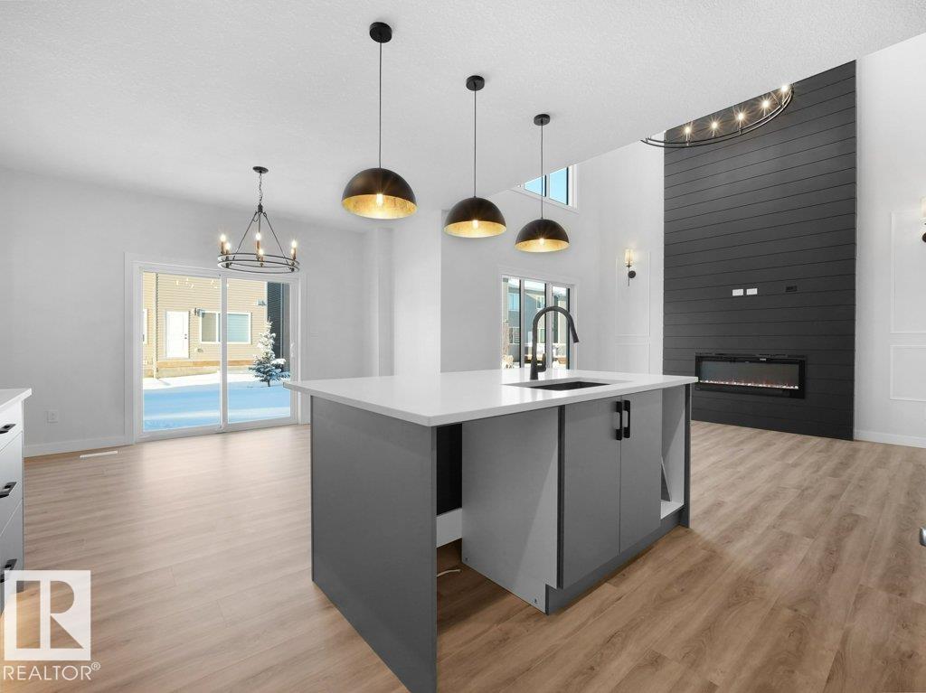 Open-to-below living room and feature wall at 3310 Chickadee Dr NW Starling