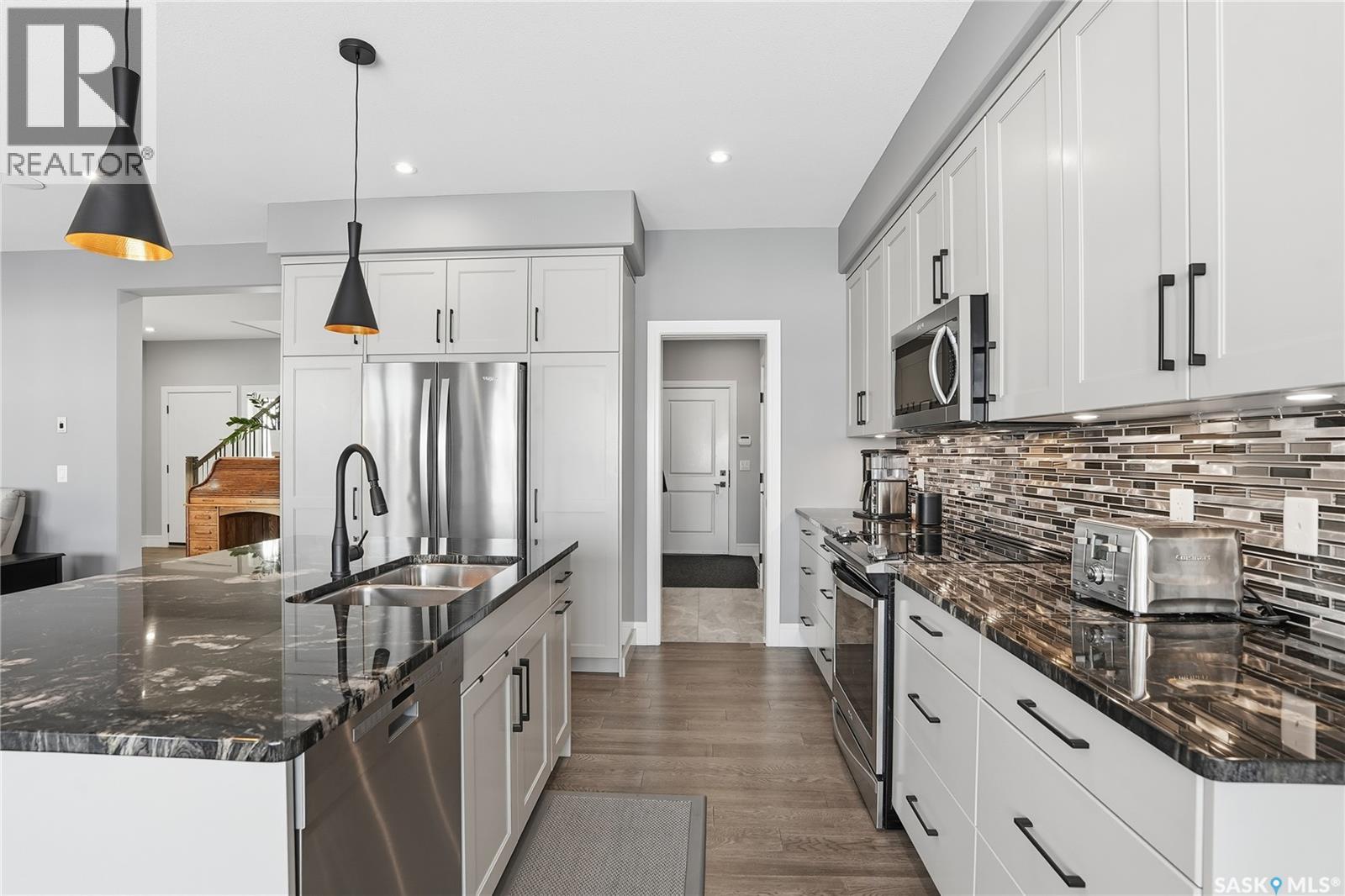 Single Family House 2 Level for Sale in  Mahabir COURT Saskatoon 