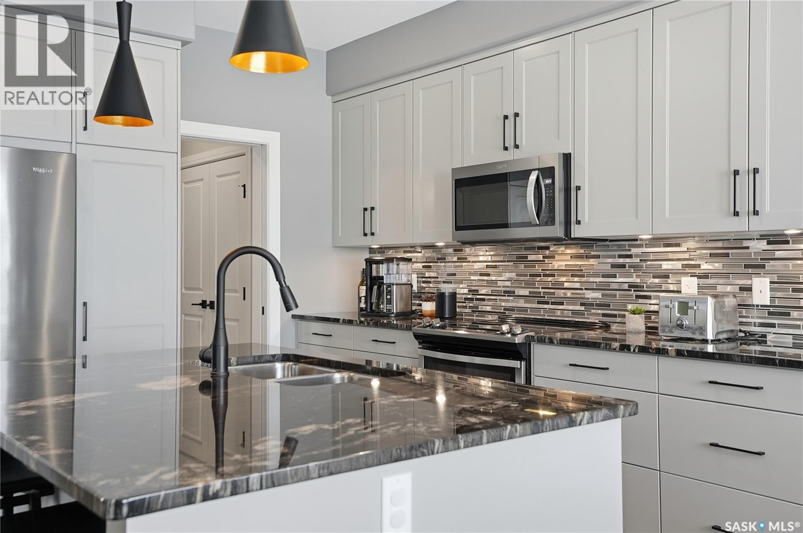 Single Family House 2 Level for Sale in  Mahabir COURT Saskatoon 