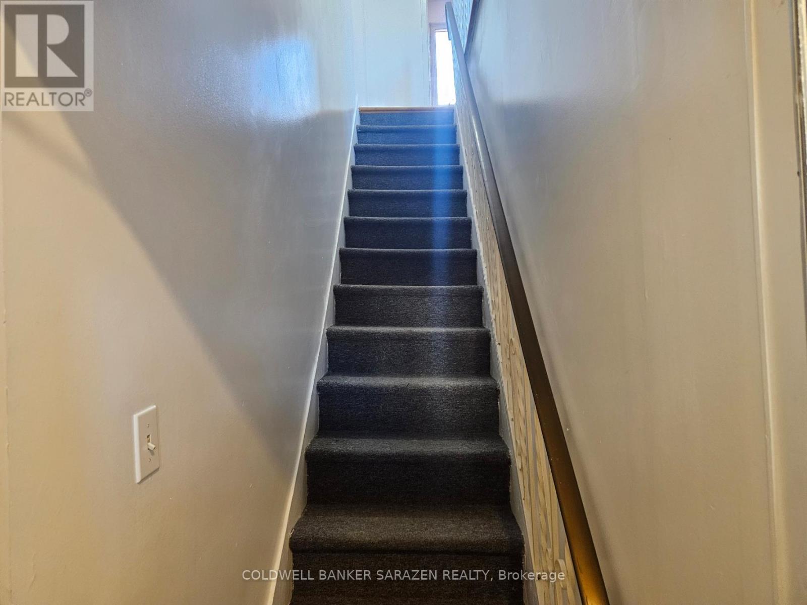 Stairs leading to second floor unit
