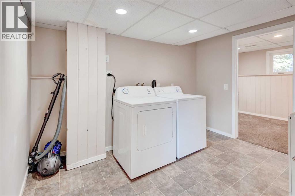 Single Family House Bi-level for Sale in  Midridge Gardens SE Midnapore Calgary 