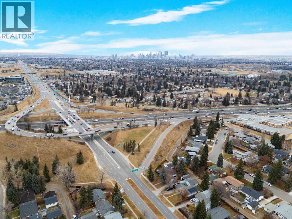 Single Family House 4 Level for Sale in  Lombardy Crescent SW North Glenmore Park Calgary 