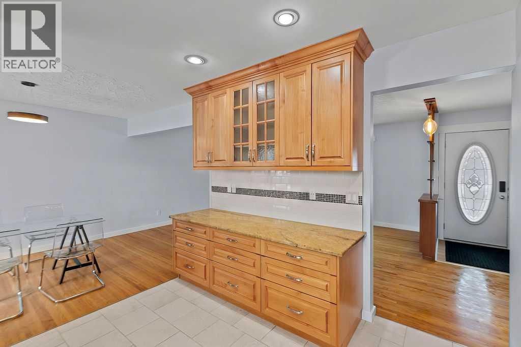 Single Family House 4 Level for Sale in  Lombardy Crescent SW North Glenmore Park Calgary 