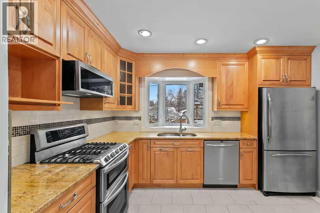 Single Family House 4 Level for Sale in  Lombardy Crescent SW North Glenmore Park Calgary 