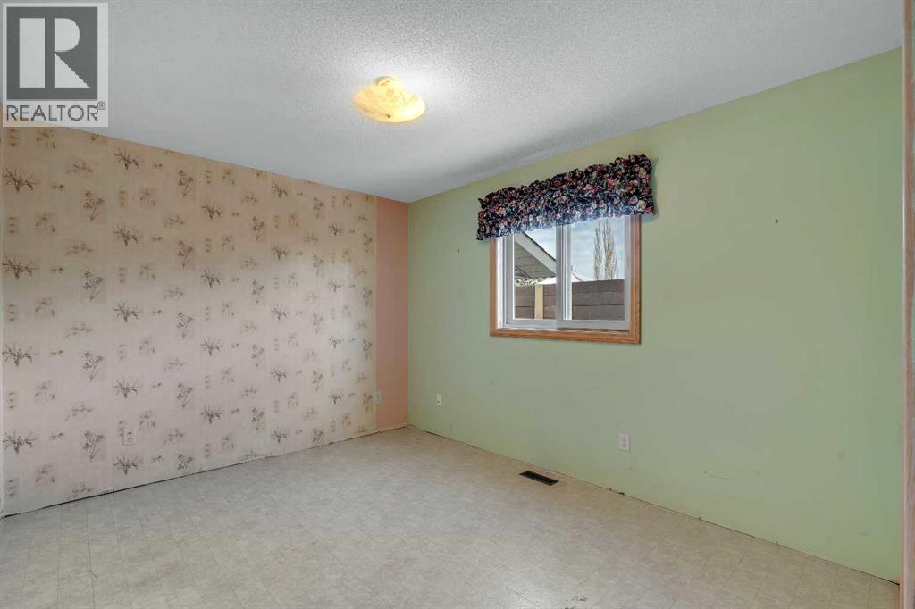 Single Family House Bungalow for Sale in  Hawkland Crescent NW Hawkwood Calgary 