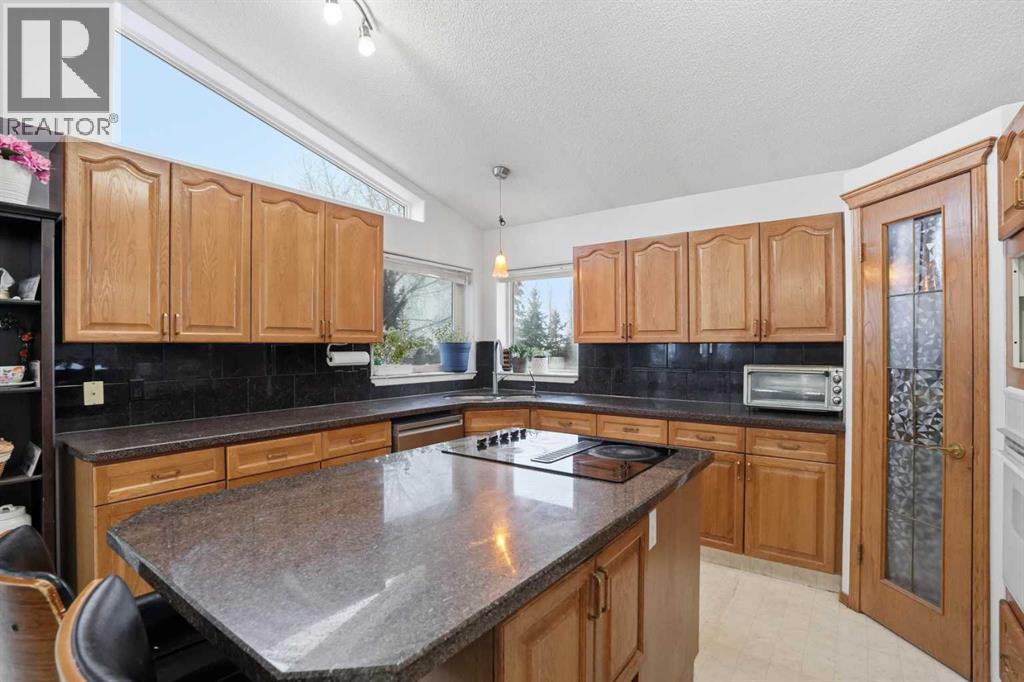 Single Family House Bi-level for Sale in  Arbour Lake Way NW Arbour Lake Calgary 