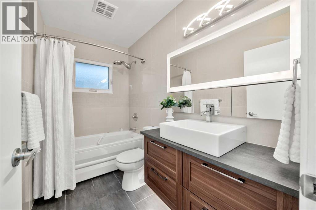 Single Family House Bi-level for Sale in  Bearspaw Drive NW Brentwood Calgary 