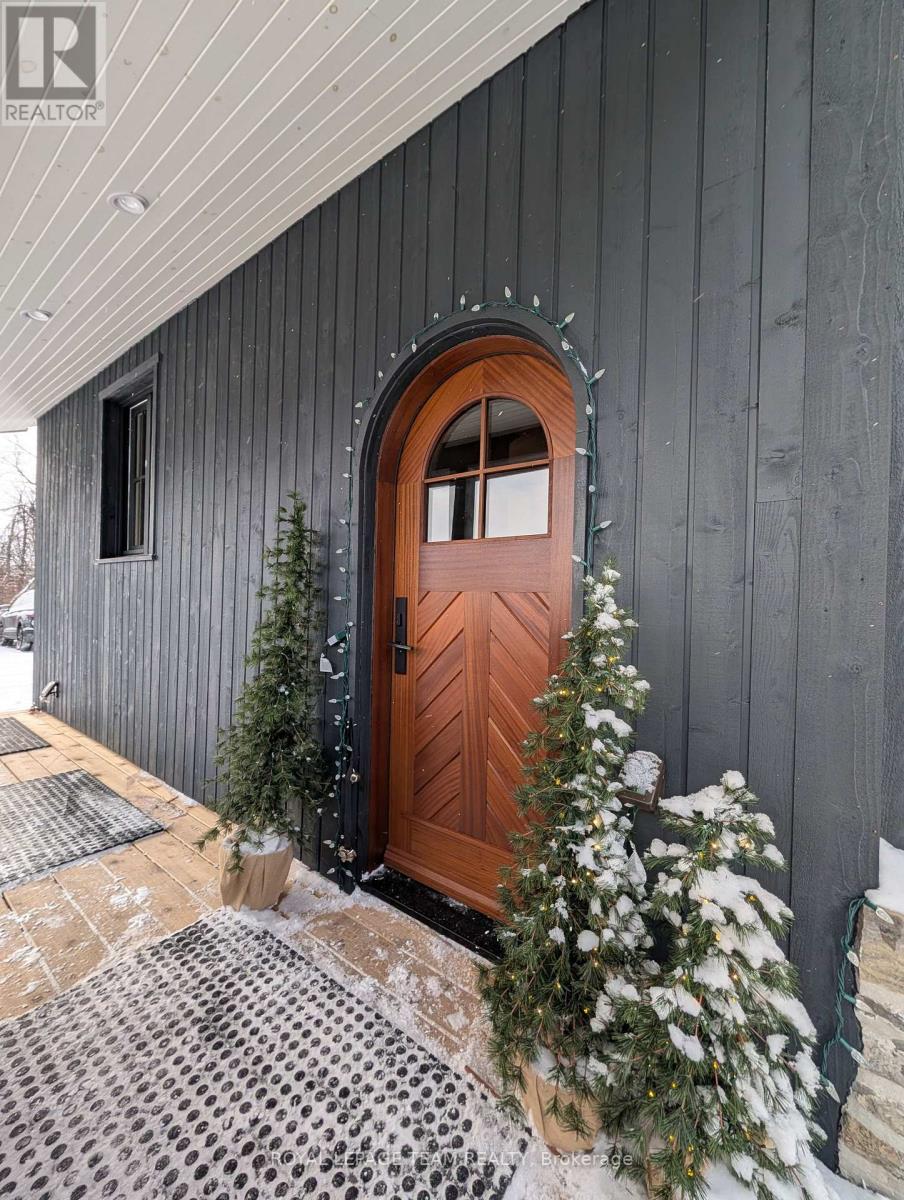 Side Entrance with arched Mahogany door