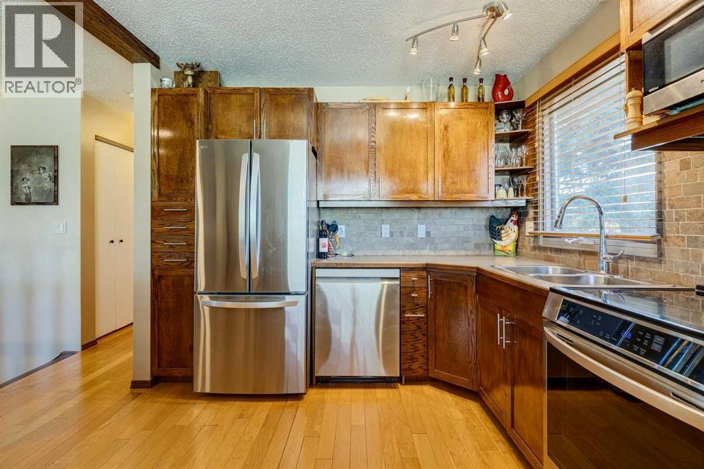 Single Family House Bi-level for Sale in  Midcrest Crescent SE Midnapore Calgary 