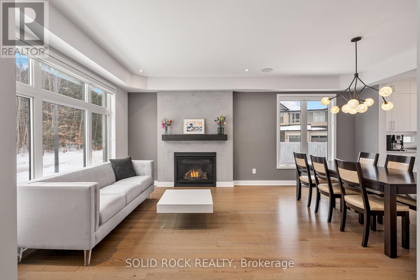 gas fireplace, big windows and a view