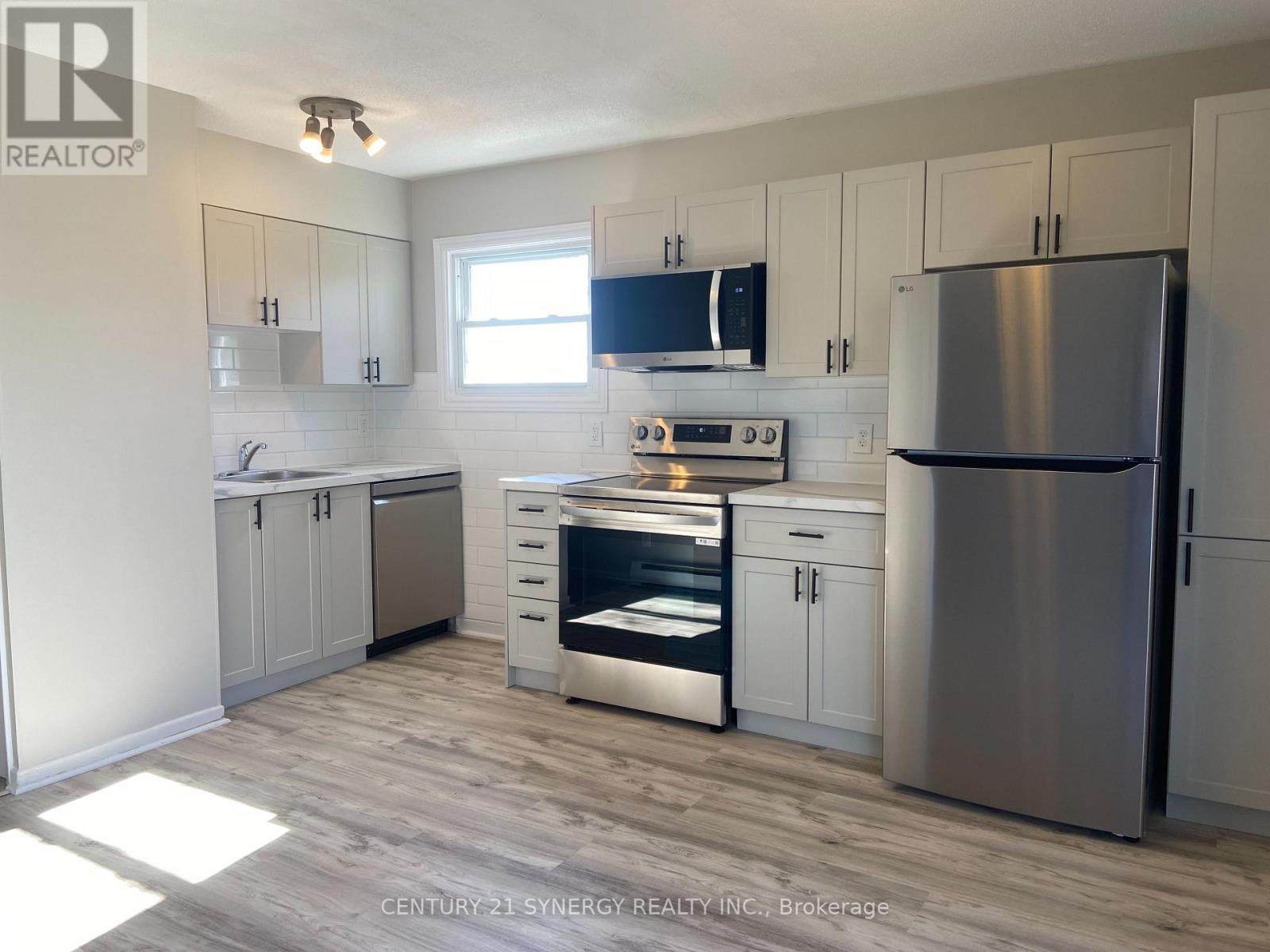 Newer stainless appliances, cabinets, floor & more
