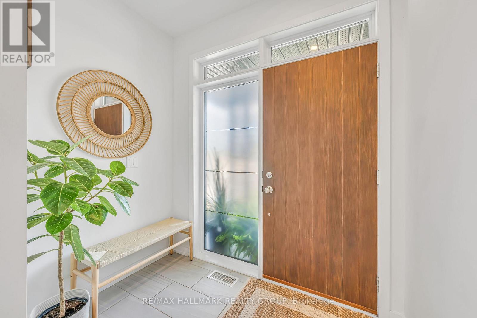 Bright foyer with modern front door
