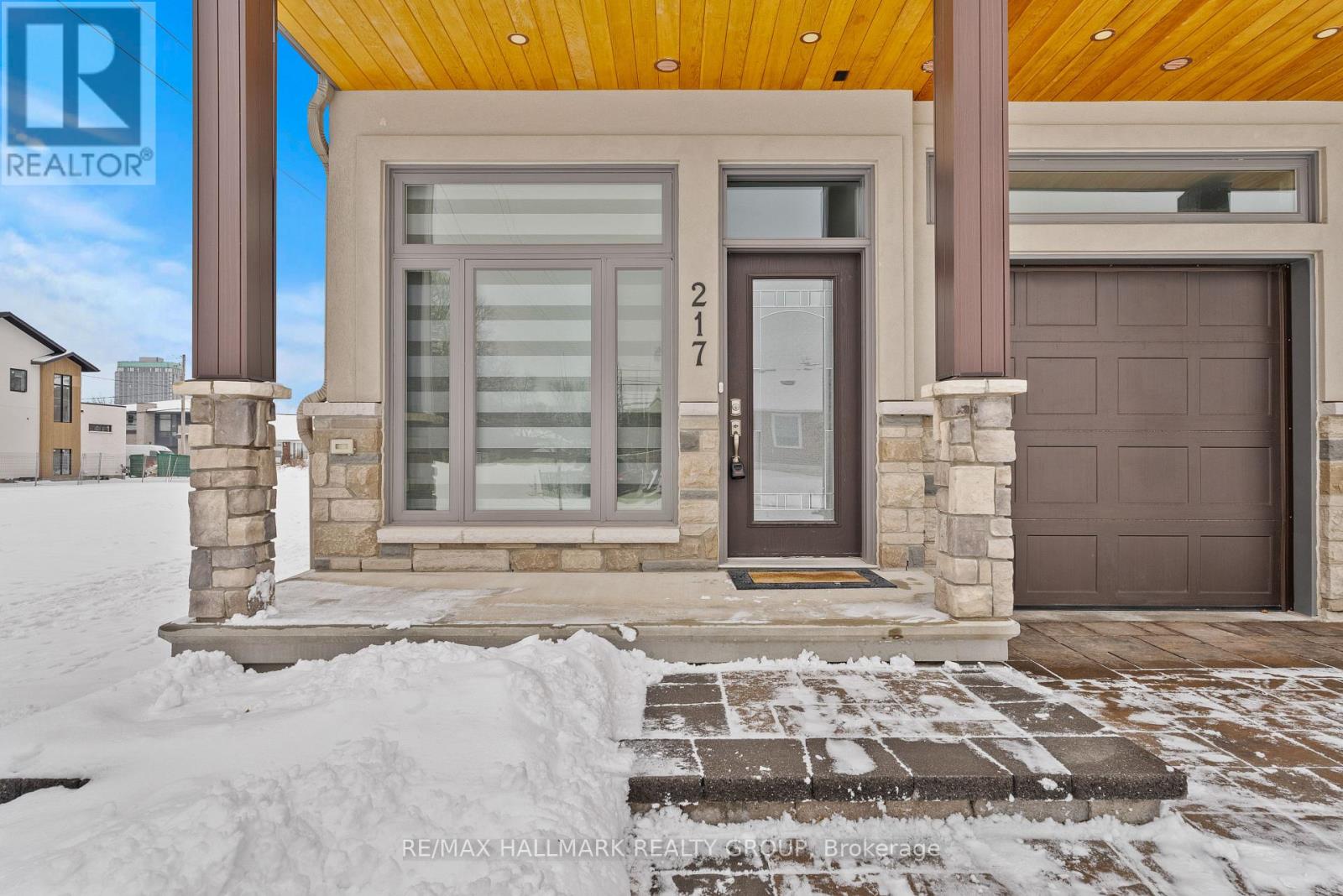 Inviting front porch with stone accents.