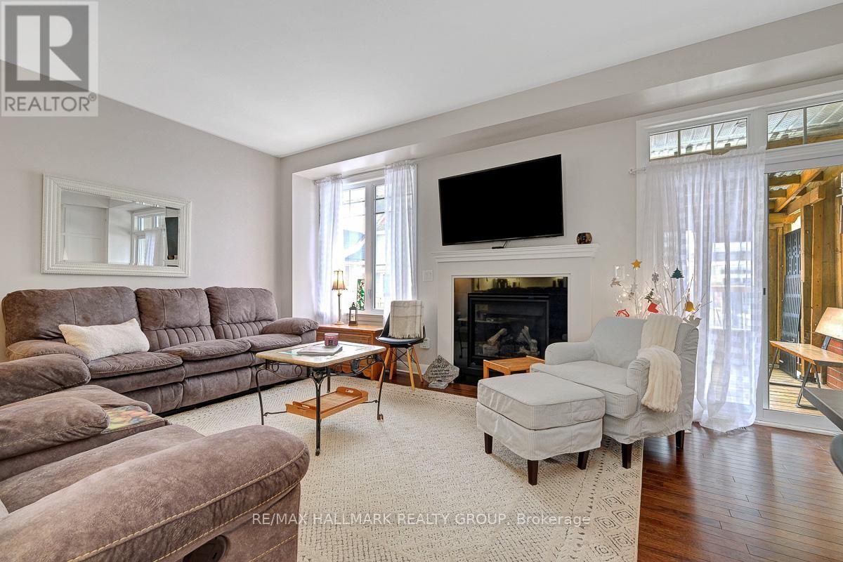 Living room with gas fireplace, access to backyard