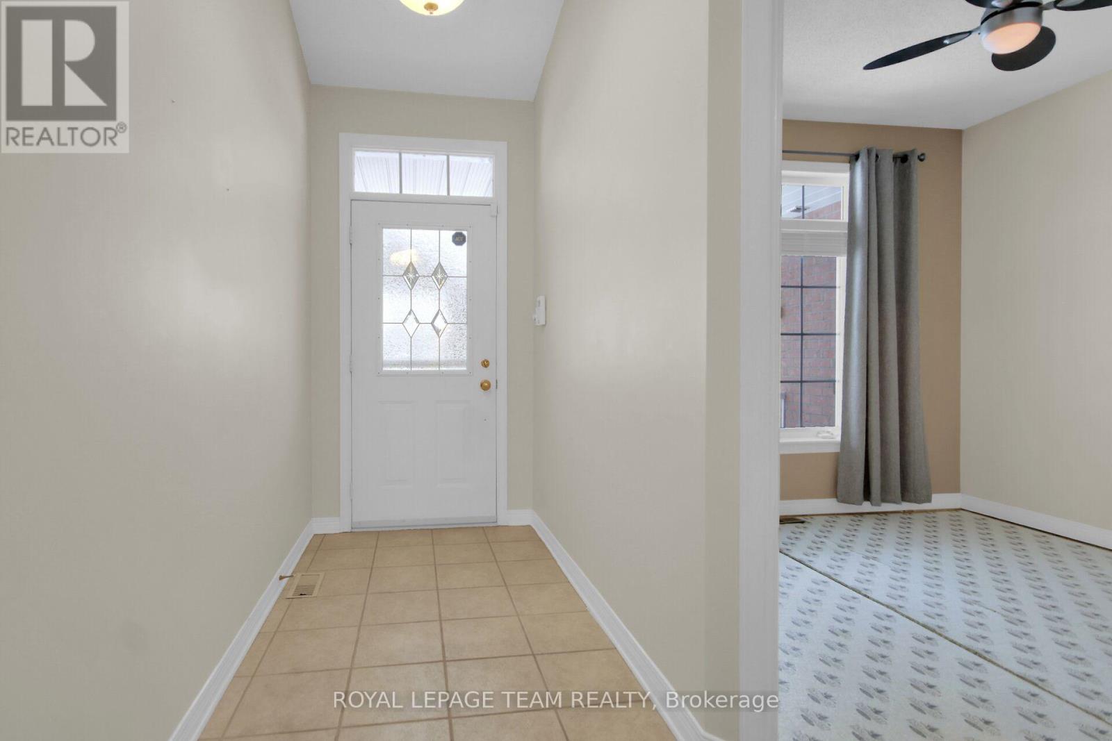 Tiled Foyer leads to an open concept living space.
