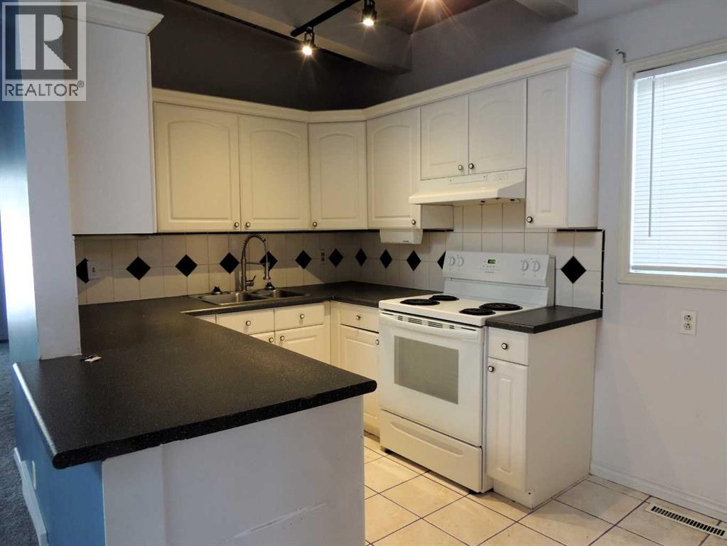 Single Family House Bi-level for Sale in  Canmore Road NW Banff Trail Calgary 