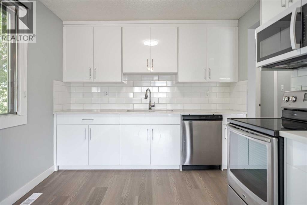 Multi-family House Bi-level for Sale in  Sabrina Road SW Southwood Calgary 