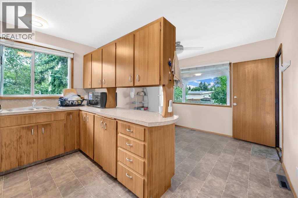 Multi-family House Bi-level for Sale in  Vance Place NW Varsity Calgary 