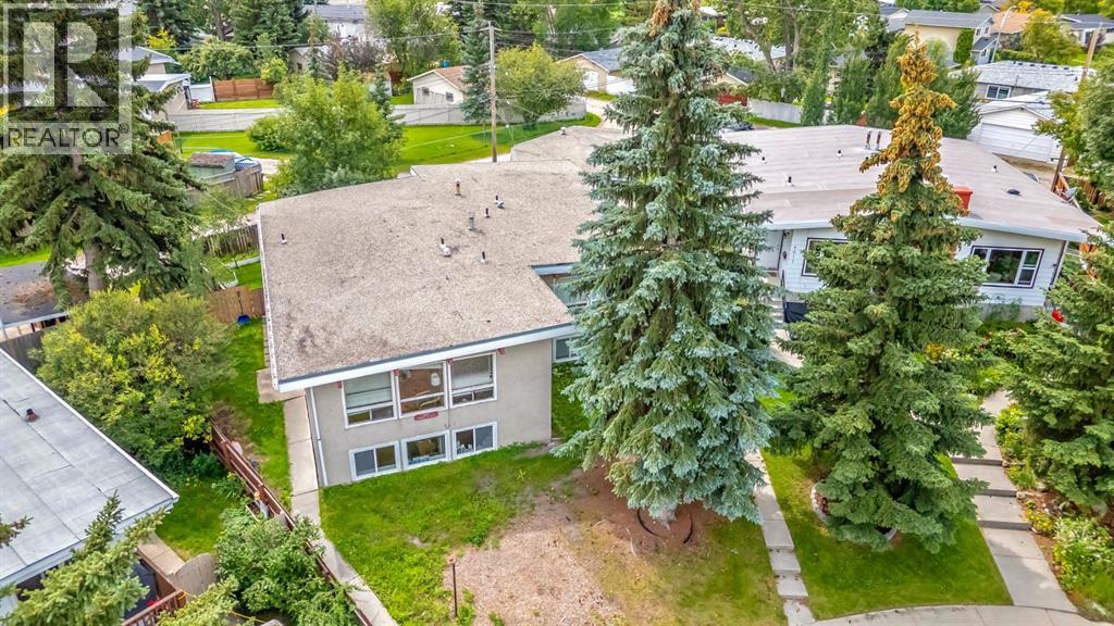 Multi-family House Bi-level for Sale in  Vance Place NW Varsity Calgary 