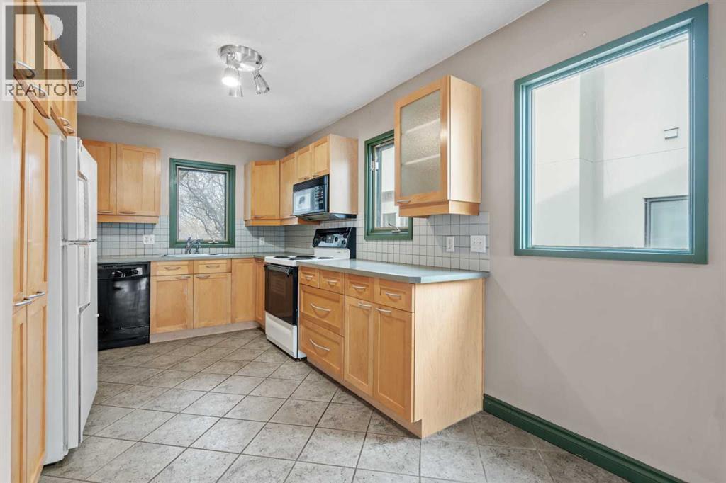 Multi-family House Bungalow for Sale in  &  A Street NW Hillhurst Calgary 