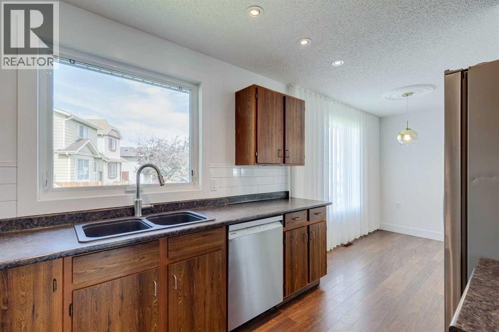 Single Family House Bungalow for Sale in  Erin Grove Court SE Erin Woods Calgary 