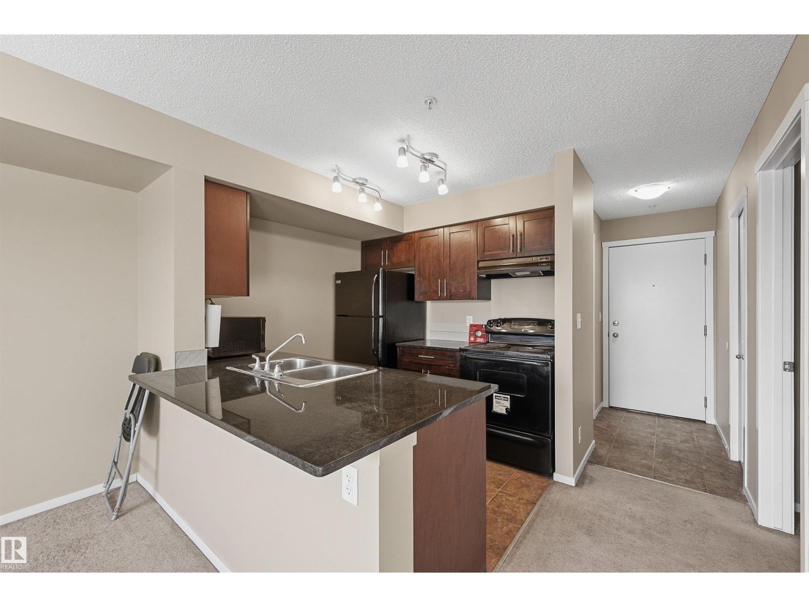 #208 5810 MULLEN PL NW - 5