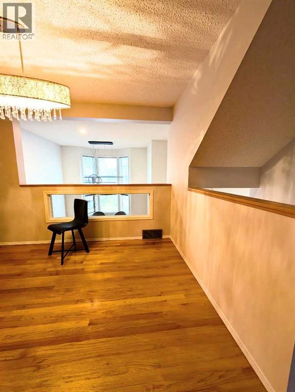 Single Family House 4 Level for Sale in  Hawkstone Manor NW Hawkwood Calgary 