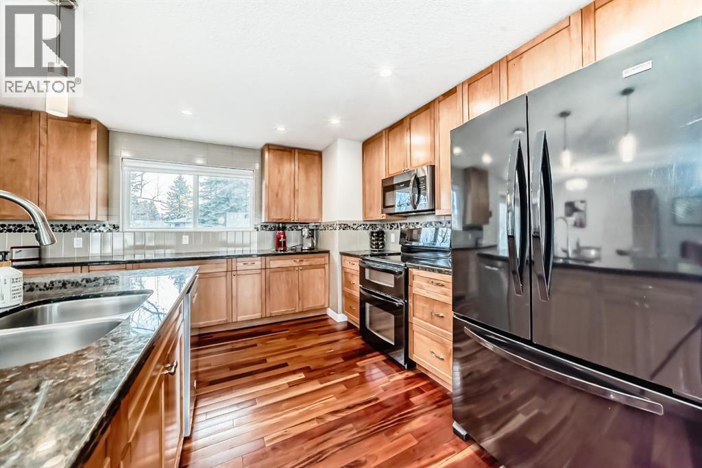 Single Family House Bi-level for Sale in  Varbow Place NW Varsity Calgary 