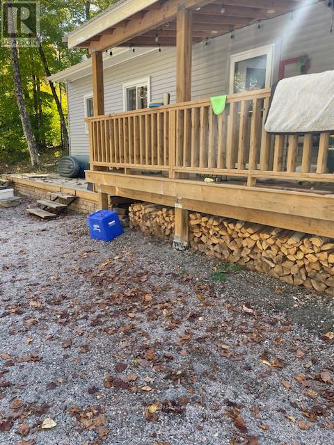 Wood storage under deck provided by Owner.