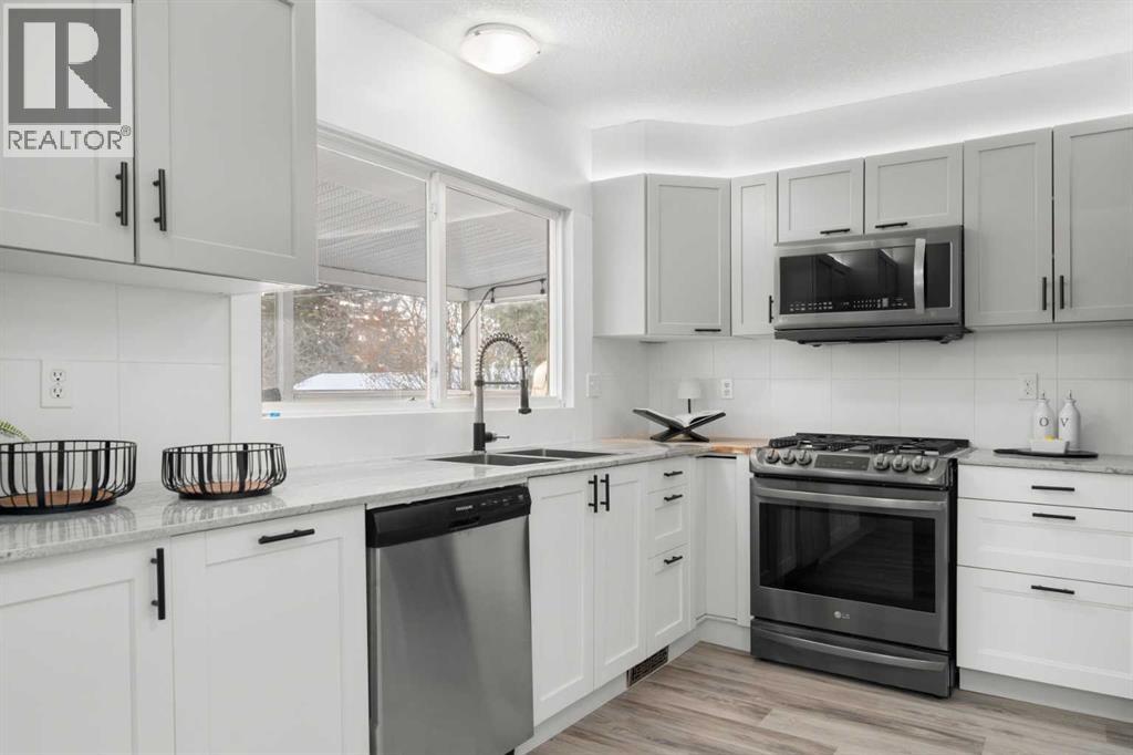 Single Family House Bi-level for Sale in  Bearspaw Drive NW Brentwood Calgary 