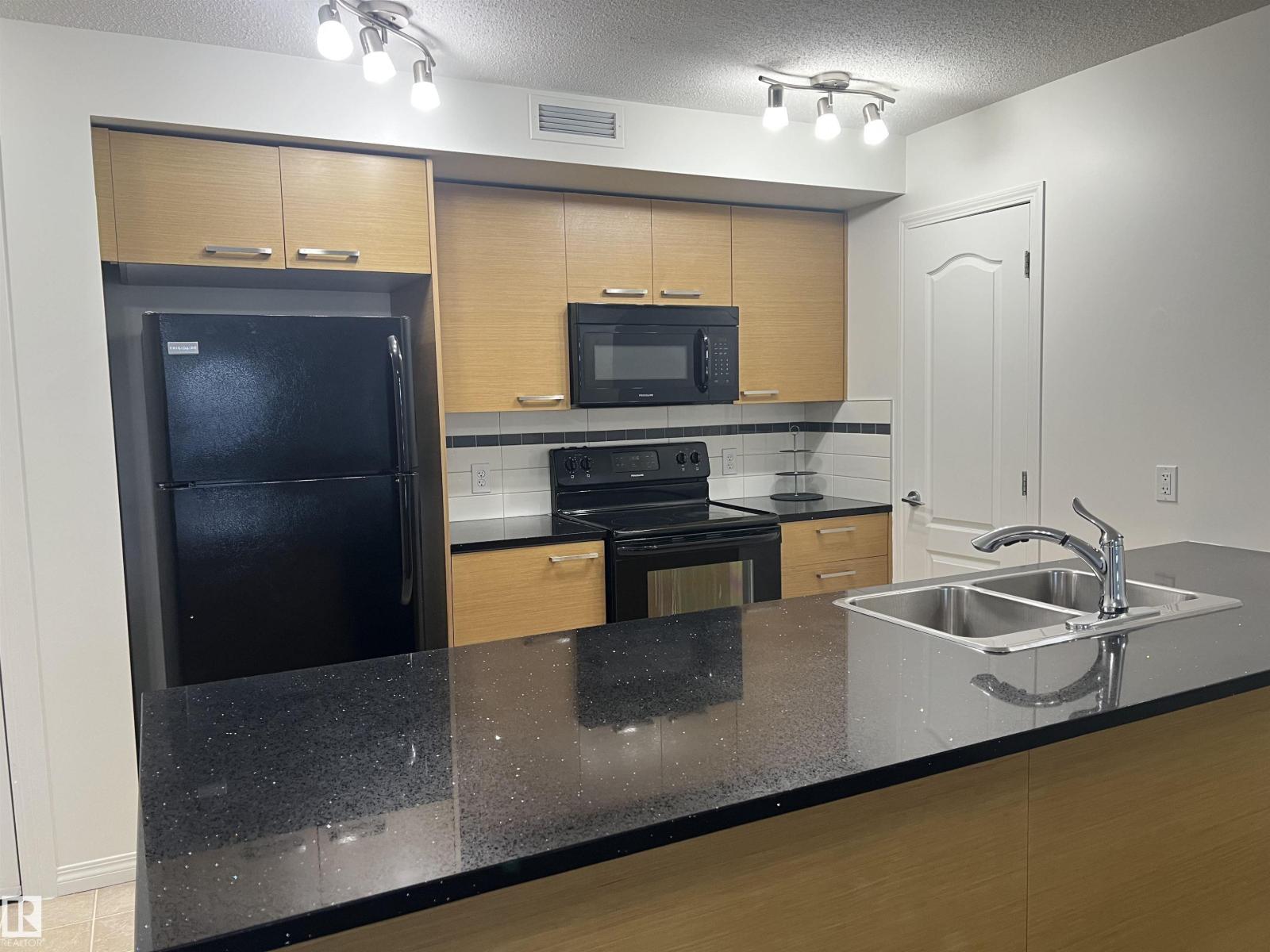 #2403 7343 SOUTH TERWILLEGAR DR NW - 17