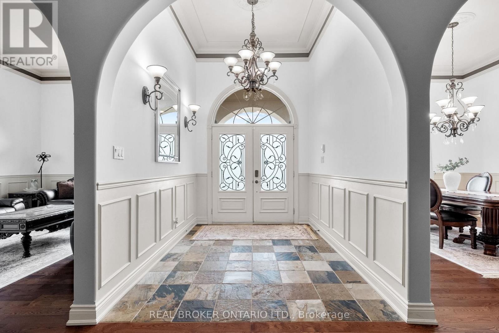 A grande Foyer welcomes you into the home