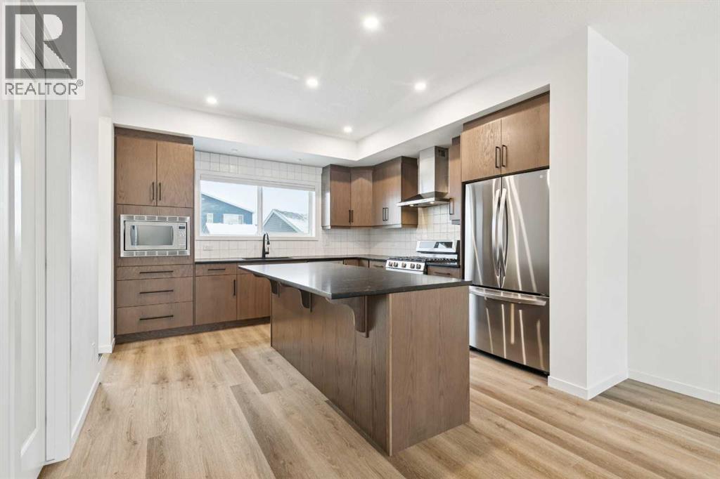 Single Family House for Sale in  Belmont Villas SW Belmont Calgary 